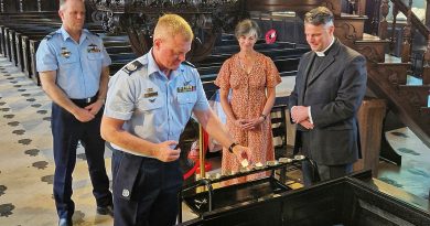 From left, Chief of Air Force Air Marshal Stephen Chappell, Warrant Officer of the Air Force Ralph Clifton; Saskia Hobbs and Reverend Mark Perry take part in the lighting of the candle ceremony. Story and photos by Lieutenant Commander John Thompson.