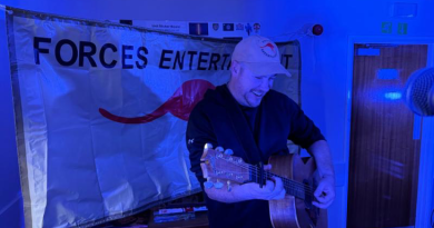 Australian guitarist Glen Harrison gives his all while performing with Australian country music star Amber Lawrence during a Forces Entertainment Tour in the UK. Story and photos by Major Dave Thompson.