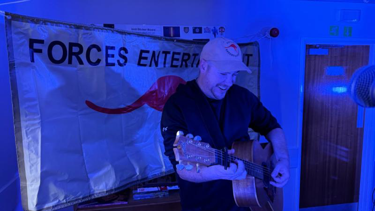 Australian guitarist Glen Harrison gives his all while performing with Australian country music star Amber Lawrence during a Forces Entertainment Tour in the UK. Story and photos by Major Dave Thompson.