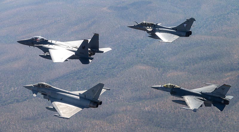 An Exercise Pitch Black multi-national formation with French Air and Space Force Rafale B; Republic of Singapore Air Force (RSAF) F-16C Fighting Falcon; Italian Air Force Eurofighter Typhoon; and RSAF F-15SG Eagle. Photo by Flying Officer Ben Dunleavy.