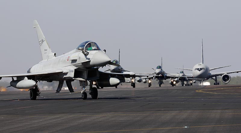 Italian Air Force (Aeronautica Militare, or AM) Eurofighter Typhoons taxi at RAAF Base Darwin, followed by an AM KC-767A tanker transport, on arrival for Exercise Pitch Black 24. Photo by Flight Lieutenant Claire Campbell.