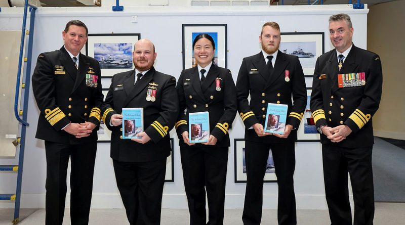 Chief of Navy Vice Admiral Mark Hammond (far left) and the Director General of the Australian Submarine Agency, Vice Admiral Jonathan Mead (far right), with Australia's first Navy officers to graduate from the Royal Navy's Nuclear Reactor Course. Story by Lieutenant Commander John Thompson. Photos by LPhot Edward Jones.