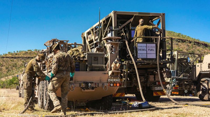 Australian Army fuel specialists from the 1st Combat Service Support Battalion work alongside petroleum operators from UK's Commando Logistics Regiment to refuel Battle Group Tiger vehicles at Timber Creek, NT, during Exercise Predator's Run. Story by Captain Annie Richardson. Photos by Corporal Madhur Chitnis.
