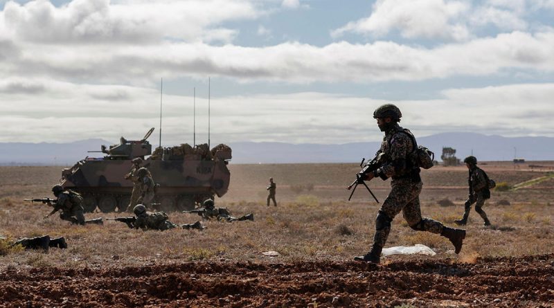 Australian and Malaysian Army soldiers conduct dry-fire rehearsals during Exercise Southern Tiger at Cultana Field Training Area, South Australia. Story by Captain Peter March. Photo by Corporal Cameron Pegg.