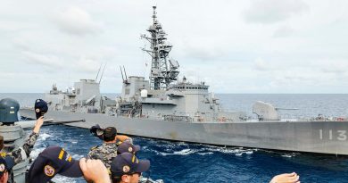 HMAS Sydney’s bridge team waves towards Japan Maritime Self-Defense Force ship JS Sazanami during a formation foxtrot as part of a regional presence deployment. Story by Lieutenant Tahlia Merigan. Photos by Leading Seaman Daniel Goodman.