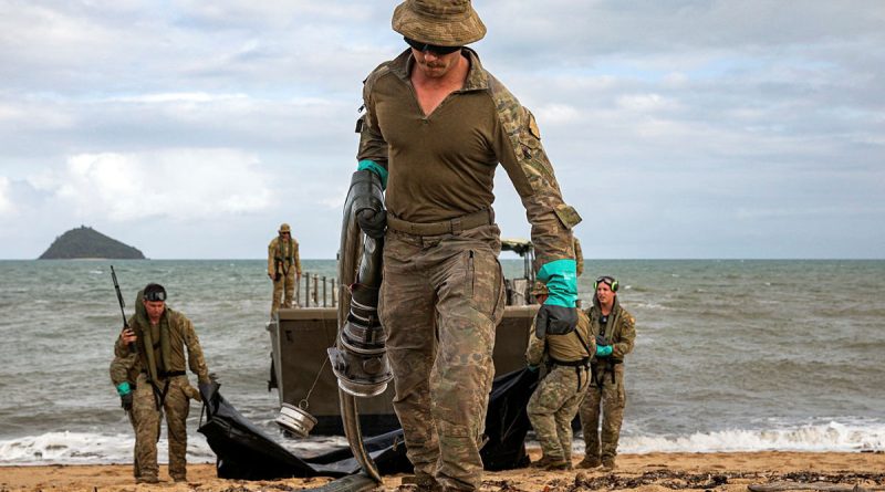 Army petroleum operator Private Mason Dearing prepares to transport fuel from an LCM-8 to the beach storage area in the vicinity of Cowley Beach Training Area, Queensland. Story by Captain Joanne Leca.