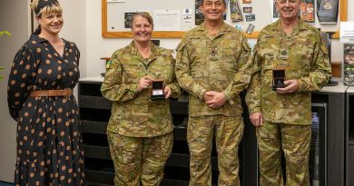 Army Major Wendi McAdie and Warrant Officer Class One Andrew McAdie are presented their Federation Star medals by Major General Michael Krause alongside their daughter, Clancy McAdie. Story by Captain Krysten Clifton. Photo by Michael Banovic.