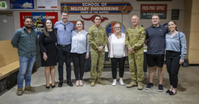Warrant Officer Class One Frank Franolic, right of centre, stands with friends and family after being presented with his third Federation Star. Story by Captain Carlie Gibson. Photo by Warrant Officer Class Two David Eason.