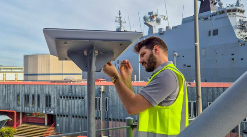 Pierre de Vallier, of the Enhanced Quality of Life Team, Navy Intelligence and Information Warfare, installs a Starlink system on board HMAS Brisbane. Story and photo by Corporal Michael Rogers.