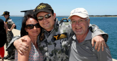 Chief Petty Officer Matthew with his wife and father after HMAS Waller berths alongside Diamantina Pier at Fleet Base West. He received a Conspicuous Service Medal during the 2025 Australia Day Honours. Story by Corporal Jacob Joseph. Photo by Chief Petty Officer Damian Pawlenko.