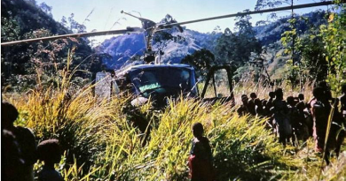 The crew of the A2-487 Iroquois, at a village near Garaina, PNG, seek witnesses to the crash of a RAAF Caribou in August 1972.