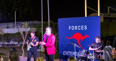 Phil Burton, centre, performs at Camp Baird Headquarters Middle East for deployed ADF personnel on Australia Day during the Forces Entertainment Tour. Story and photos by Leading Seaman Nadav Harel.