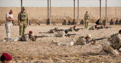 Australian Army Captain Anthony Davis, left, instructs Iraqi soldiers of the Taji Military Complex's Non-Commissioned Officer Academy as they practise fire and movement towards a notional enemy position at the Taji Military Complex, Iraq. Story and photos by Sergeant Matthew Bickerton.