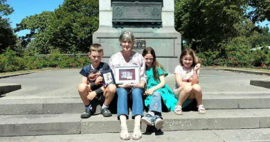 Karen Curtis and her grandchildren with the World War 2 service medals of her great uncle Sergeant William O’Shea at the Timaru War Memorial in New Zealand, after the medals were returned by Chaplain Haydn Lea. Story by Corporal Jacob Joseph.