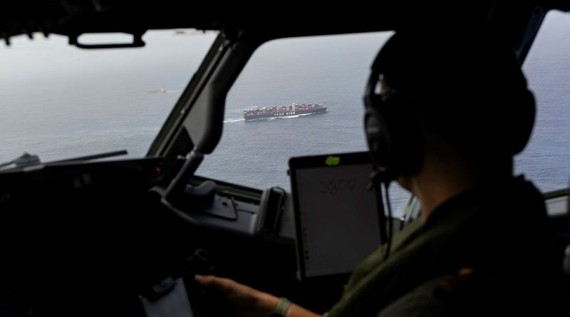 Royal Australian Navy pilot Lieutenant Jure Plestina observes a vessel from a Royal Australian Air Force P-8A Poseidon aircraft during a coordinated maritime domain awareness activity in the South China Sea. Story by Flight Lieutenant Imogen Lunny. Photos: byCorporal Emma Schwenke.
