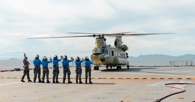 Members of HMAS Choules’ flight deck team prepare an Army CH-47 Chinook for take-off during deck-landing practice while off the coast of Townsville. Story by Chief Petty Officer Helen Frank. Photos by Able Seaman Danyellah Hill.