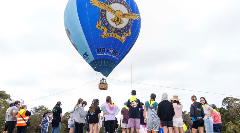 Families at the Very Special Kids Camp line up for their flight in the Air Force Balloon. Story by Flying Officer Rose Gigliotti. Photos by Leading Aircraftwoman Paris Rigney.