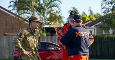 Australian Army officer Lieutenant Andrew Hvejsel, from 6 Battalion, Royal Australian Regiment, talks with Queensland State Emergency Service officers about assisting Hervey Bay residents in the wake of Ex-Tropical Cyclone Alfred. Story by Captain Cody Tsaousis. Photo by Private Gabriel Argent.