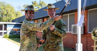 Colonel Anthony Cattai, left, hands over the 13th Brigade pennant to Commander 2nd (Australian) Division Major General Matthew Burr during the 13th Brigade transfer-of-authority parade at Irwin Barracks. Story by Major Dean Benson.