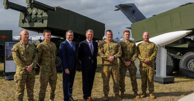 The Minister for Defence Richard Marles and Minister for Defence Industry Pat Conroy gather for a group photo with Australian Army soldiers after speaking to the media about the HIMARS at the Australian International Air Show 2025, Avalon Airport. Photo by Leading Aircraftman Ryan Howell.