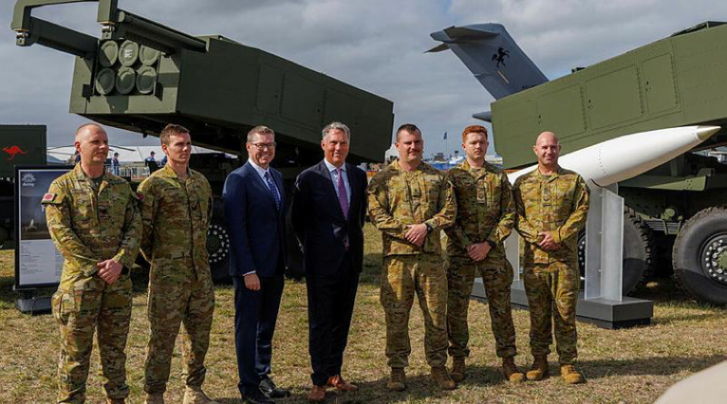 The Minister for Defence Richard Marles and Minister for Defence Industry Pat Conroy gather for a group photo with Australian Army soldiers after speaking to the media about the HIMARS at the Australian International Air Show 2025, Avalon Airport. Photo by Leading Aircraftman Ryan Howell.