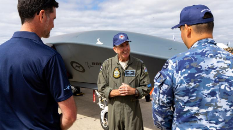Wing Commander Phil Parsons, from the Collaborative Autonomous Systems Project Office, speaks with aviators and representatives from Boeing about the capabilities of the Boeing MQ-28 at the Australian International Airshow 2025. Story by Flight Lieutenant Sharon Sebastian. Photo by Leading Aircraftman Campbell Latch.