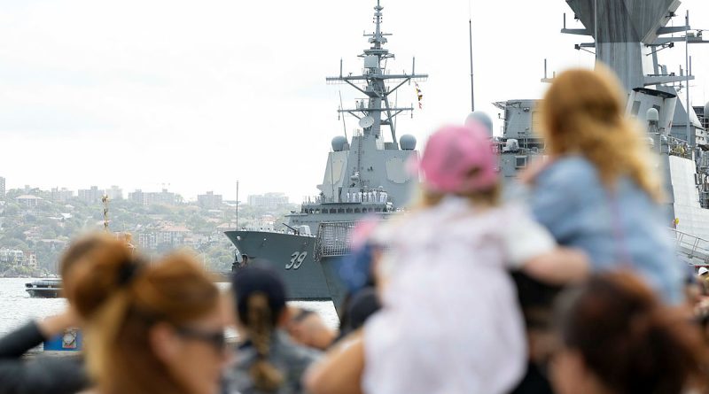 Families prepare to welcome HMAS Hobart back to Fleet Base East in Sydney after three months on deployment. Photo by Able Seaman Lauren Pugsley.