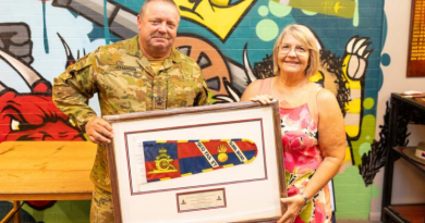Warrant Officer Class Two Kim Johansen stands alongside his wife, Michelle, after being presented the Federation Star clasp to his Defence Long Service Medal for 40 years of service, at Gallipoli Barracks, Queensland. Story by Captain Nigel Jacobs. Photo by Lance Corporal Luke Donegan.