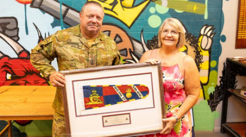 Warrant Officer Class Two Kim Johansen stands alongside his wife, Michelle, after being presented the Federation Star clasp to his Defence Long Service Medal for 40 years of service, at Gallipoli Barracks, Queensland. Story by Captain Nigel Jacobs. Photo by Lance Corporal Luke Donegan.
