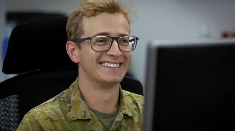 Royal Australian Air Force officer Flight Lieutenant Zac Pattison at his computer while deployed on Operation Accordion at Headquarters Middle East in 2025. Story and photo by Corporal Luke Bellman.