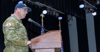 The Royal Australian Navy's Captain Jorge McKee addresses a change-of-command ceremony. Story by Lieutenant Commander Andrew Herring. Photos by Spc. Christ-Claude Mowandza-Ndinga.