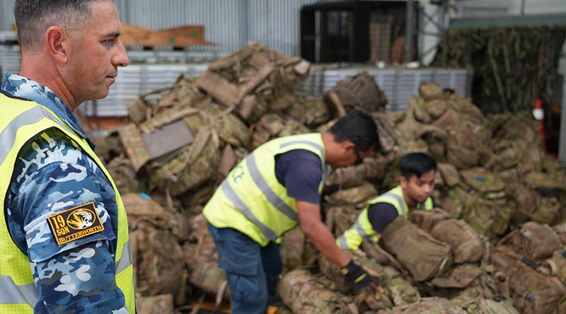 Sergeant Paul Scandura of 19 Squadron oversees locally engaged civilians constructing aircraft pallets to support a Rifle Company Butterworth (RCB) rotation. Photo by Flight Lieutenant Michael Gosney.