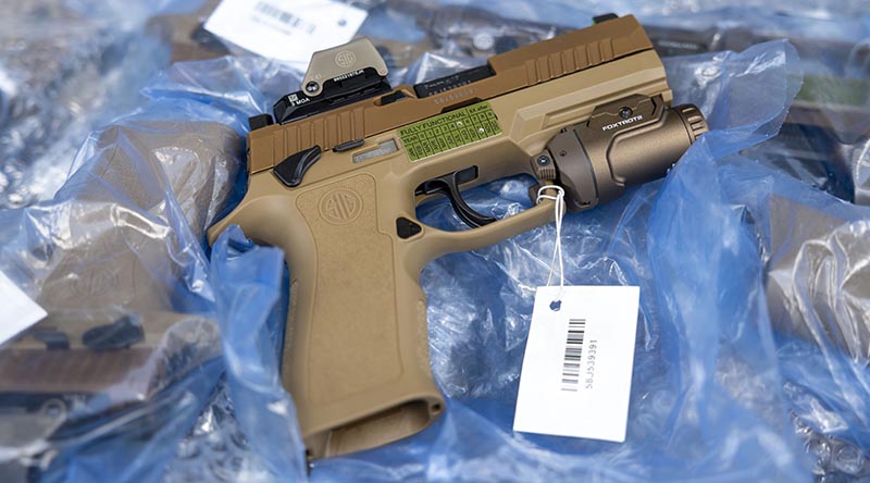 The Australian Defence Force has selected the F9 pistol as its newest sidearm. Its lightweight design and high-capacity magazine make it a top choice for military use. Photo by Corporal Janet Pan.