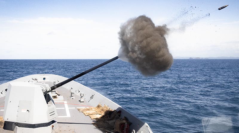 HMAS Sydney conducts a 5-inch gun firing in support of soldiers ashore at Shoalwater Bay, Queensland, during Regional Presence Deployment 25-2. Photo by Leading Seaman David Cox.