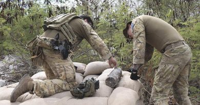Sergeant Matthew Watson and Sapper Daniel Almer from 20th Explosive Ordnance Disposal Squadron prepare an unexploded ordnance for disposal during Operation Render Safe 25-B Nauru. Photo by Sergeant Samuel Miller.