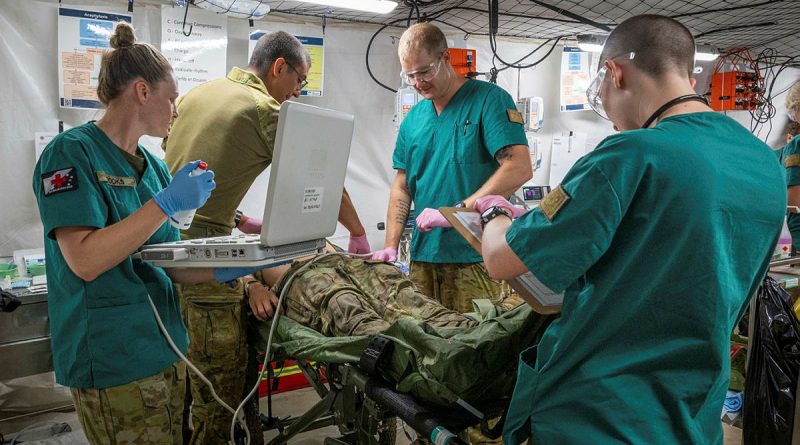 Medical staff from 3rd Health Battalion treat a simulated casualty during rehearsals as part of Exercise Balikatan in Palawan, Philippines. Story by Lieutenant Emily Tinker. Photos by Leading Seaman Kylie Jagiello.