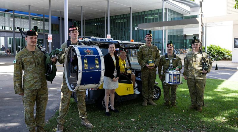 Soldiers of the 3rd Battalion, the Royal Australian Regiment, present a donation to Brighter Lives at Townsville University Hospital, Queensland. Photos by Lance Corporal Caitlyn Davill.