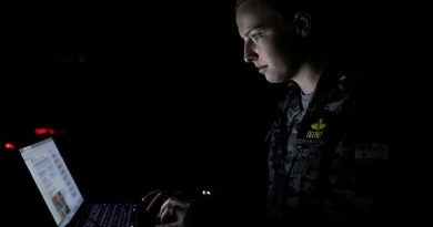 Navy Lieutenant Jacqui Heeney, from Fleet Cyber Unit, works in the cyber cell at Headquarters Integrated Area Defence System during Exercise Bersama Shield at Royal Malaysian Air Force Base Butterworth. Story and photo by Corporal Jacob Joseph.