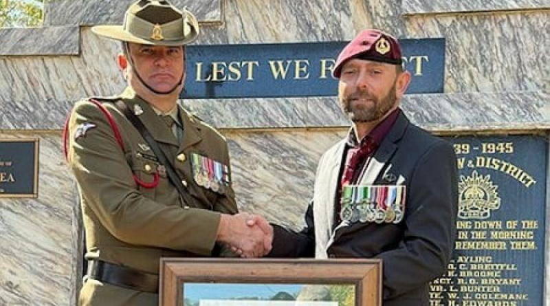 Major Vernon Andrews presents Warrant Officer Class 2 (retd) Gene Cowin with a replacement warrant in his home town of Batlow, NSW, on Anzac Day 2025. Story by Leading Seaman Nadav Harel.