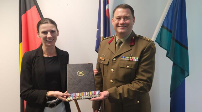 Deputy Surgeon General ADF and Head of the Royal Australian Army Medical Corps, Brigadier Isaac Seidl, presents Sir ‘Weary’ Dunlop’s granddaughter, Diana, with a set of miniature medals. Story by Michael Hoare.