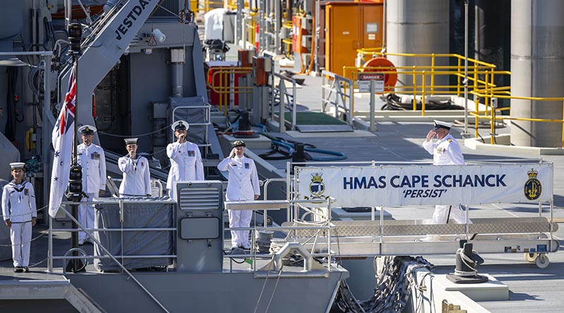 Commanding Officer HMAS Cape Schanck Lieutenant Commander Christopher Wardle is piped across the gangway for the first time during a Commissioning ceremony held at HMAS Coonawarra, Darwin, Northern Territory. Photo by Petty Officer Leo Baumgartner.