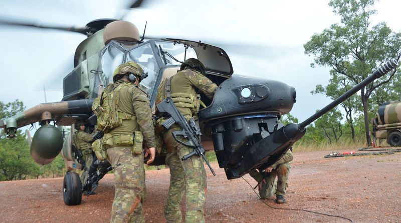 Army forward arming and refuelling point operators, of 1st Aviation Regiment, carry out a weapon clearance drill on an ARH Tiger during Exercise Griffin Walk. Story and photos by Captain Tadek Markowski.