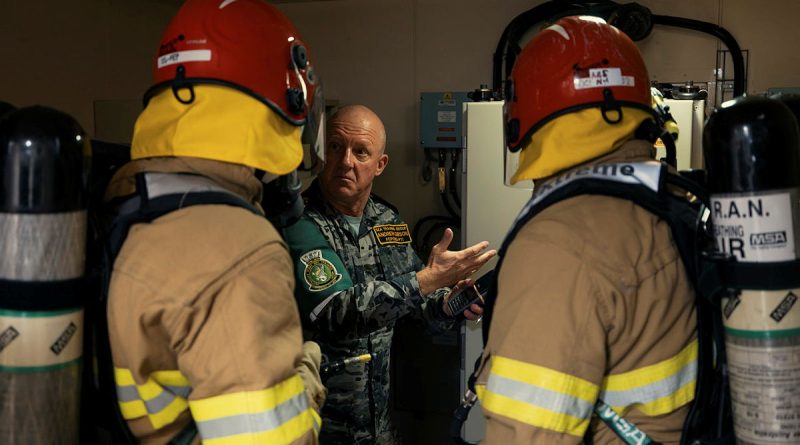 Members of HMAS Canberra's Standing Sea Fire and Emergency Party conduct damage control training with Chief Petty Officer Andrew Gibson from Sea Training Group during a transit to Wellington, New Zealand. Story by Lieutenant Michael Wilson. Photos by Petty Officer Jarrod Mulvihill.