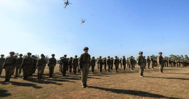 Soldiers of the 5th/7th Battalion, Royal Australian Regiment, on parade with Army reconnaisance helicopters from 1st Aviation Regiment during the Battle of Binh Ba commemoration service held in Darwin. Story by Captain Nicholas Marquis. Photo by Corporal Madhur Chitnis.