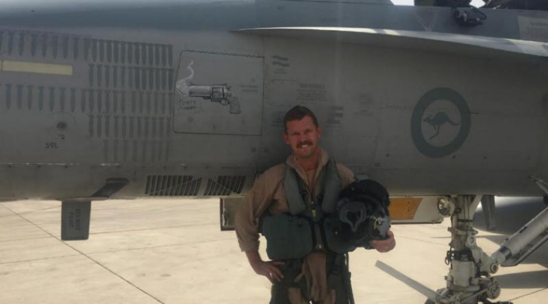 Then-Squadron Leader Ray 'Homer' Simpson, Executive Officer 3 Squadron, on Operation Okra, in front of his F/A-18A Classic Hornet featuring 'Dirty Harry smoking gun' nose art hand drawn by Corporal Patrick Kelly after Homer's strafe pass, the first by a 3 Squadron aircraft since WW2. Story by Flight Lieutenant Grace Casey-Maughan.