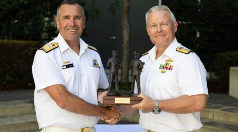 Deputy Chief of Navy, Rear Admiral Matt Buckley, receives the 'Weight' of office on handover from Commodore Eric Young at Russell Offices, Canberra. Story by Lieutenant Carolyn Martin. Photo by Leading Seaman Jarrod Mulvihill.