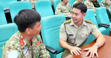 Captain Brendan Nguyen engages with a student during mental health training in Ho Chi Minh City. Story and photos by Lieutenant Carolyn Martin.