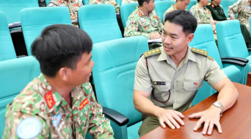 Captain Brendan Nguyen engages with a student during mental health training in Ho Chi Minh City. Story and photos by Lieutenant Carolyn Martin.
