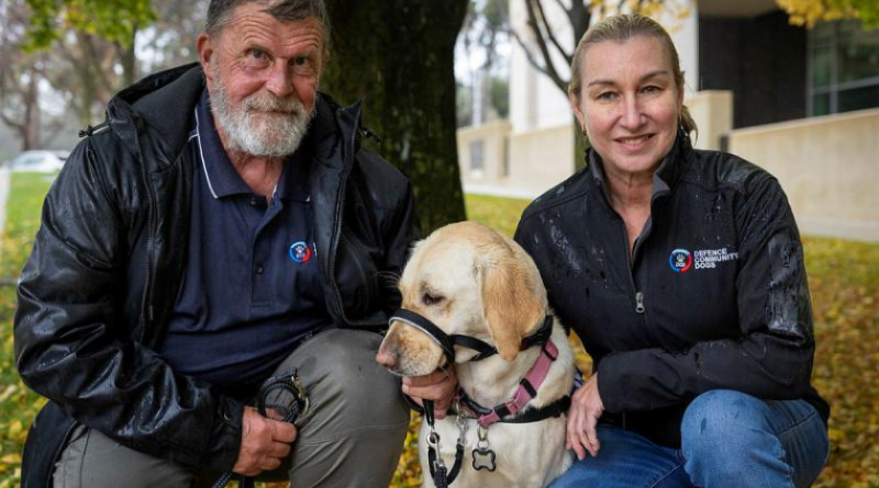 Peter Mengel with his Labrador Peaches and Defence Community Dogs Managing Director Leanne Kyle during a Defence Community Dogs awareness day at Russell Offices, Canberra. Story and photos by Corporal Jacob Joseph.