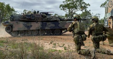 Soldiers look on as an Australian M1A1 Abrams tank passes by during Exercise Talisman Sabre 2023. Photo by Corporal Michael Currie.